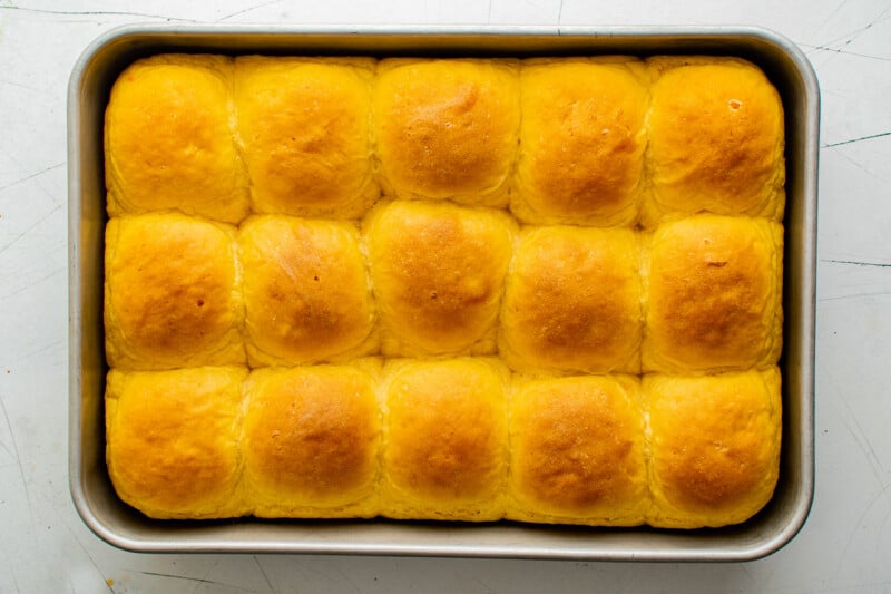 sweet potato rolls in a baking dish after baking