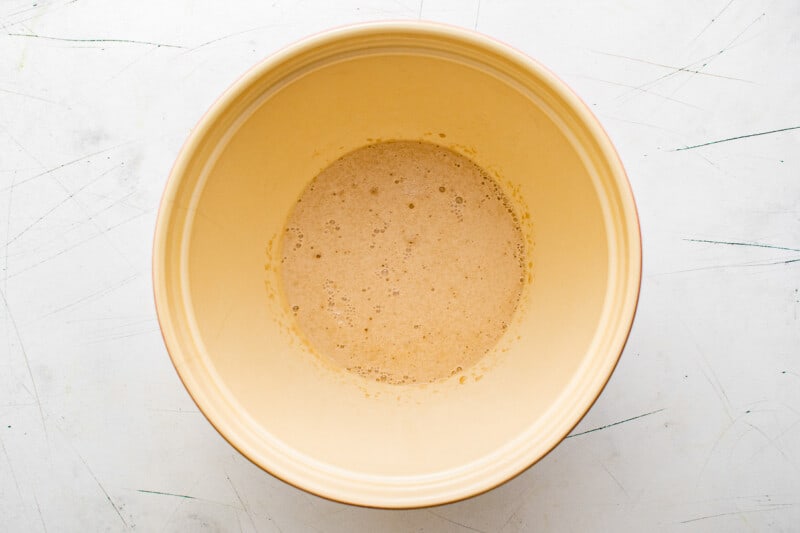 yeast, water, and sugar in a bowl