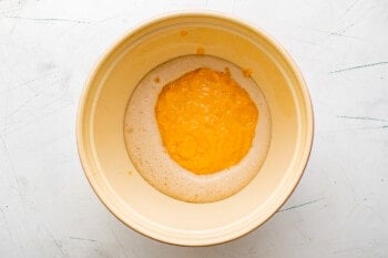 wet ingredients for sweet potato rolls in a bowl