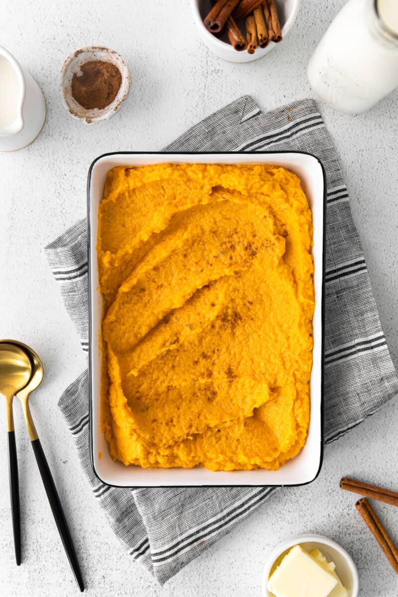 mashed sweet potatoes in a white rectangle baking dish