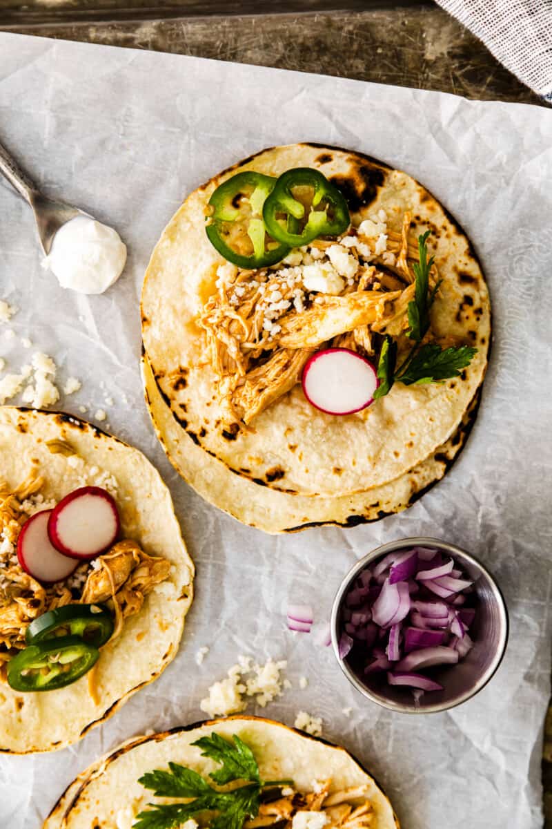 instant pot shredded chicken tacos on baking sheet