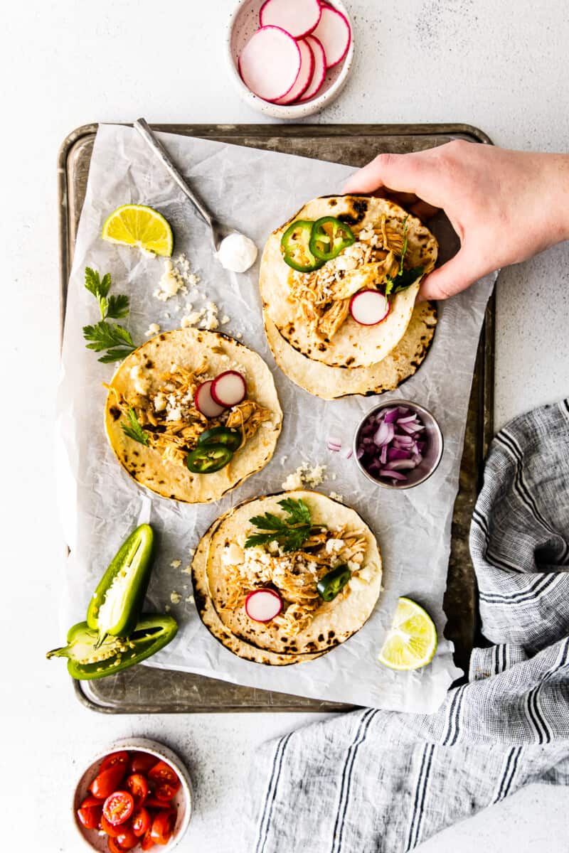 instant pot shredded chicken tacos on baking sheet