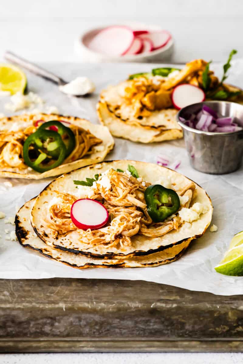 instant pot shredded chicken tacos on baking sheet