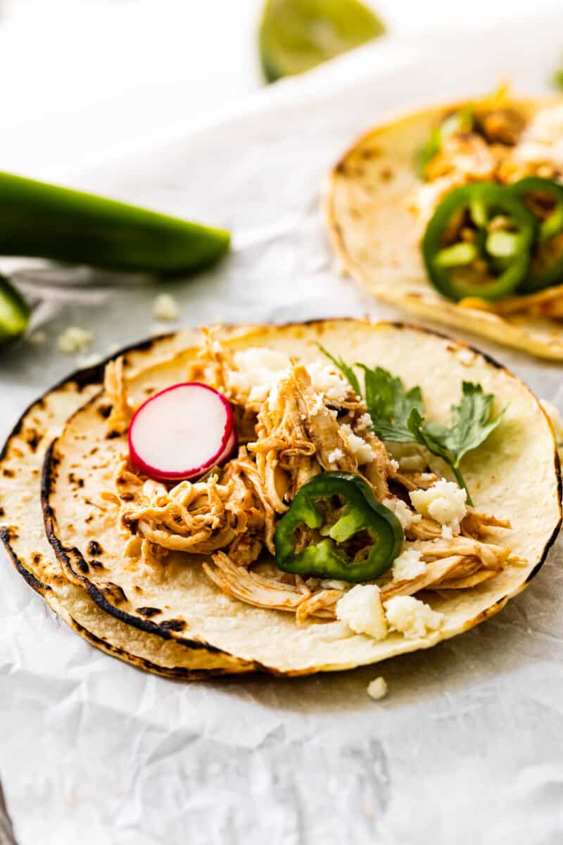 instant pot shredded chicken tacos on baking sheet