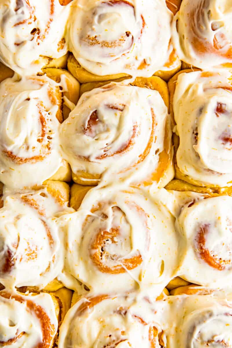 frosted orange rolls in baking dish