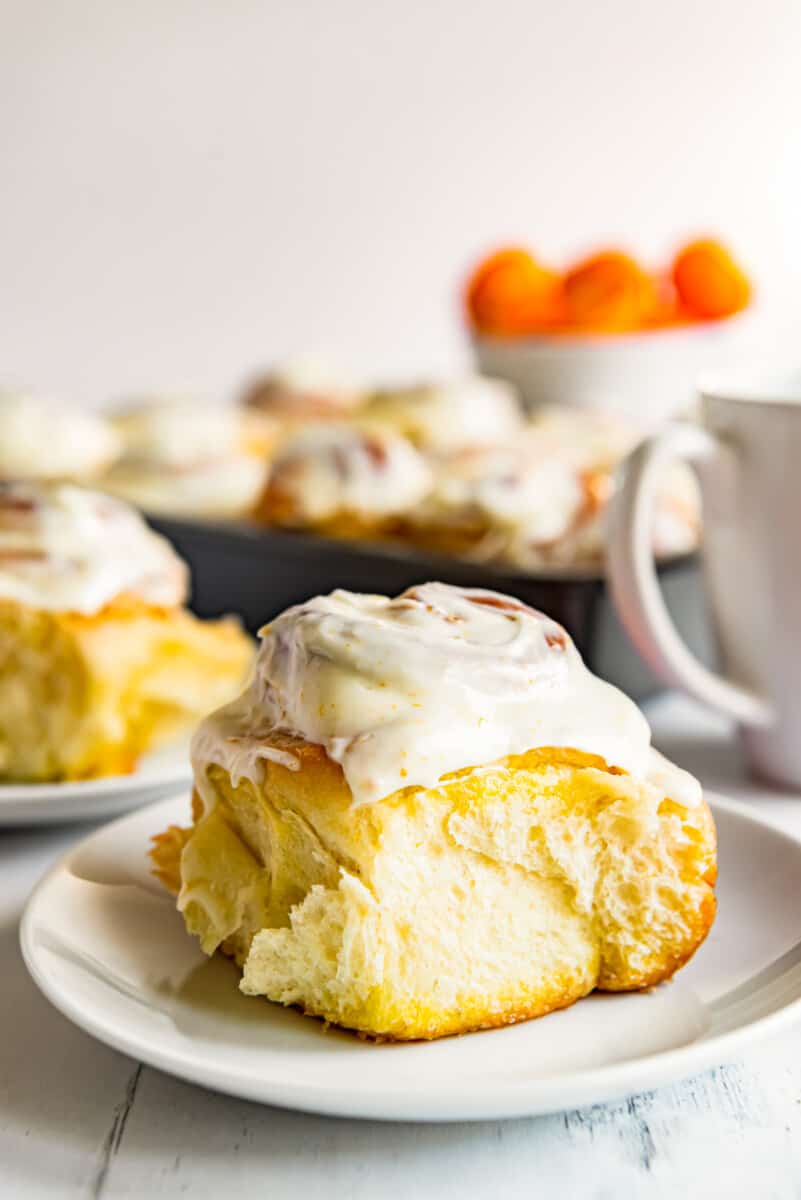 frosted orange roll on plate