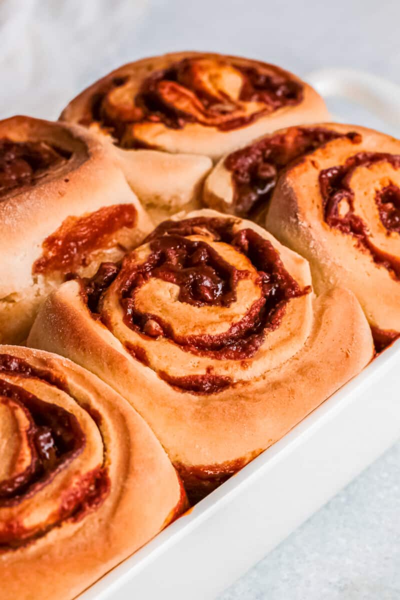 up close pecan caramel rolls in baking dish