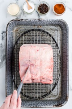 uncooked prime rib in a baking pan