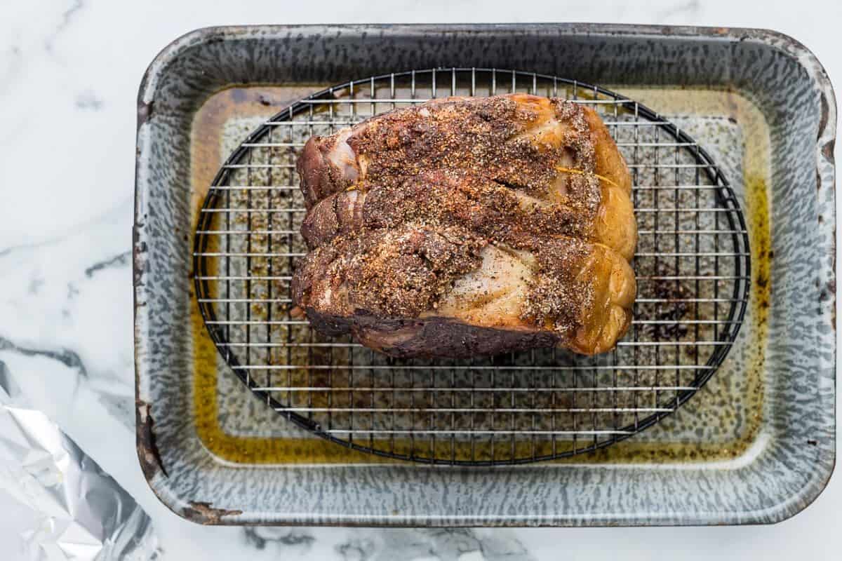 cooked prime rib roast in a baking pan