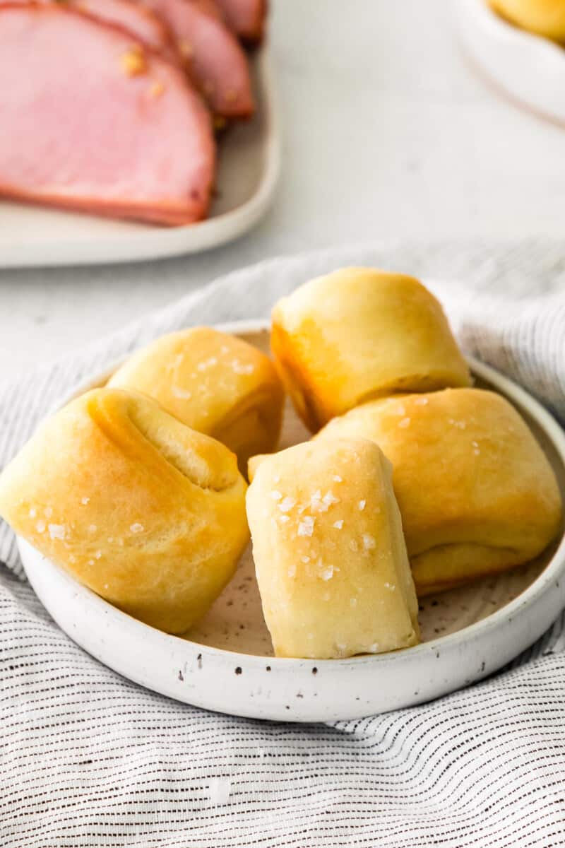 parker house rolls on a white plate