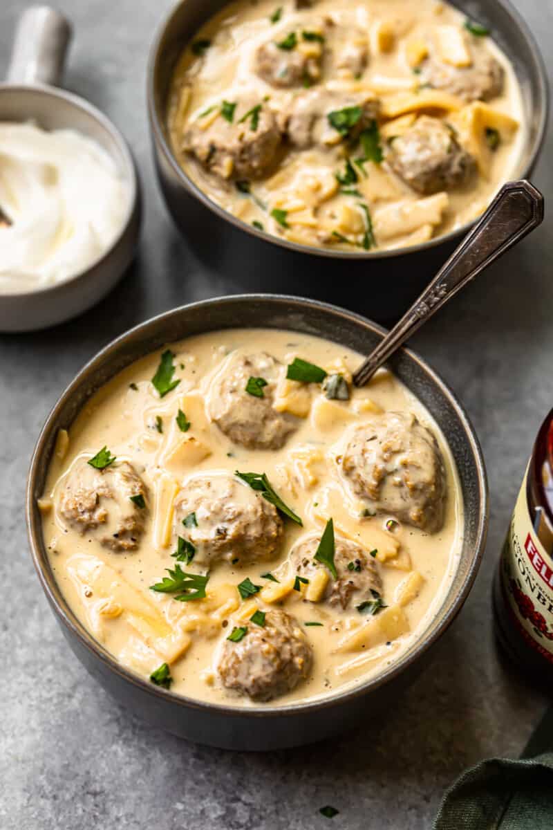 2 bowls of swedish meatball soup with spoons