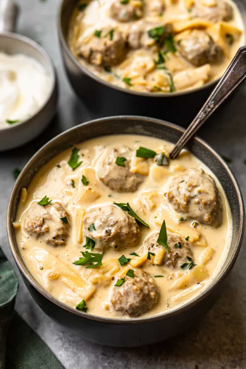 2 bowls of swedish meatball soup with spoons