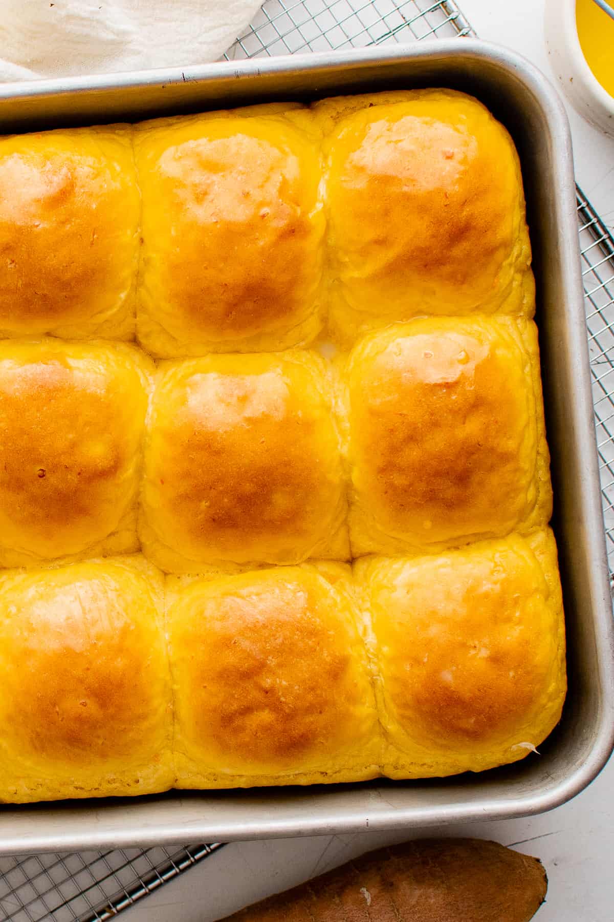 sweet potato rolls in a baking dish after baking
