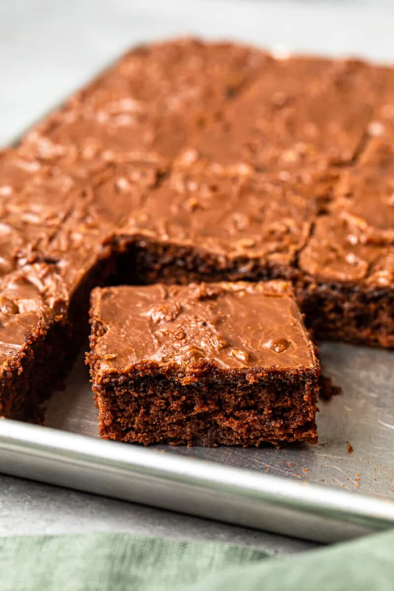 texas sheet cake in a shet pan with a square cut