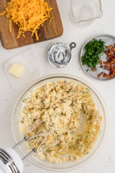 filling for twice baked potatoes in a glass bowl