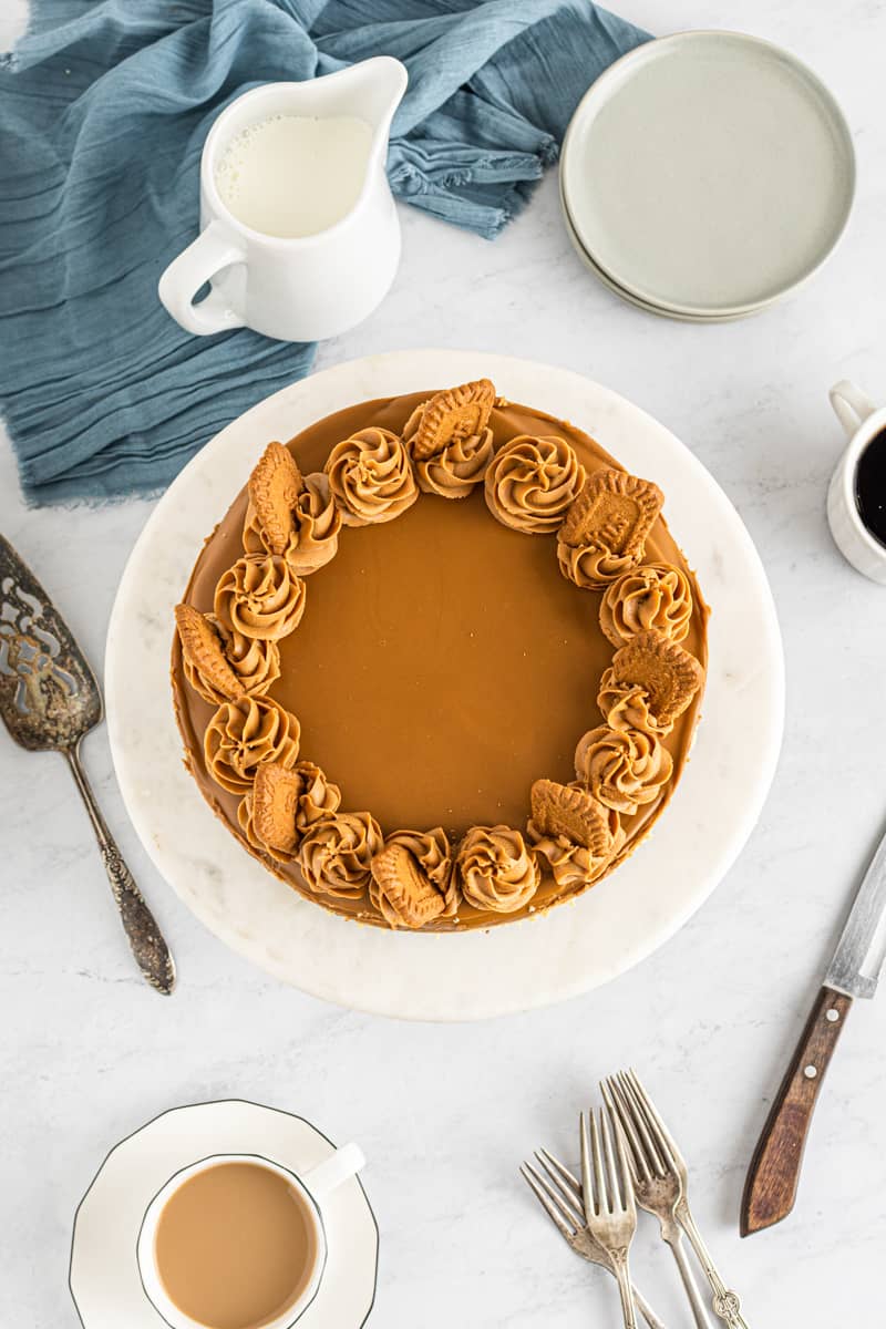 overhead image of biscoff cheesecake on a white serving tray