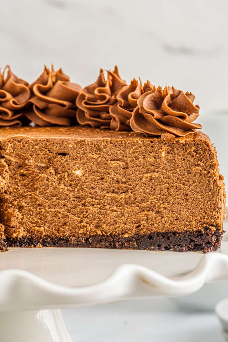 side view of sliced chocolate cheesecake showing the texture