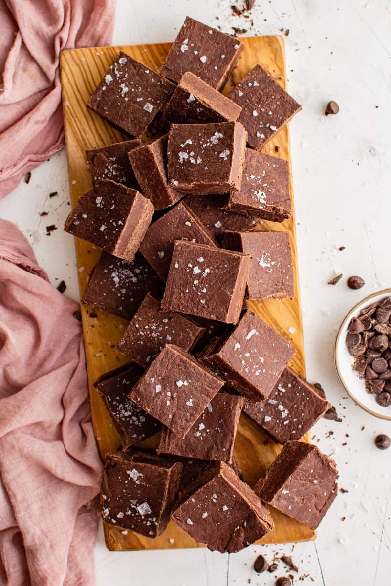 overhead image of squares of fudge on a wood serving tray