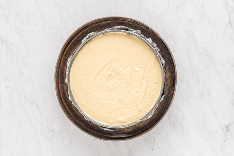 biscoff cheesecake in a springform pan before baking