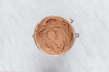chocolate cheesecake batter in a metal bowl