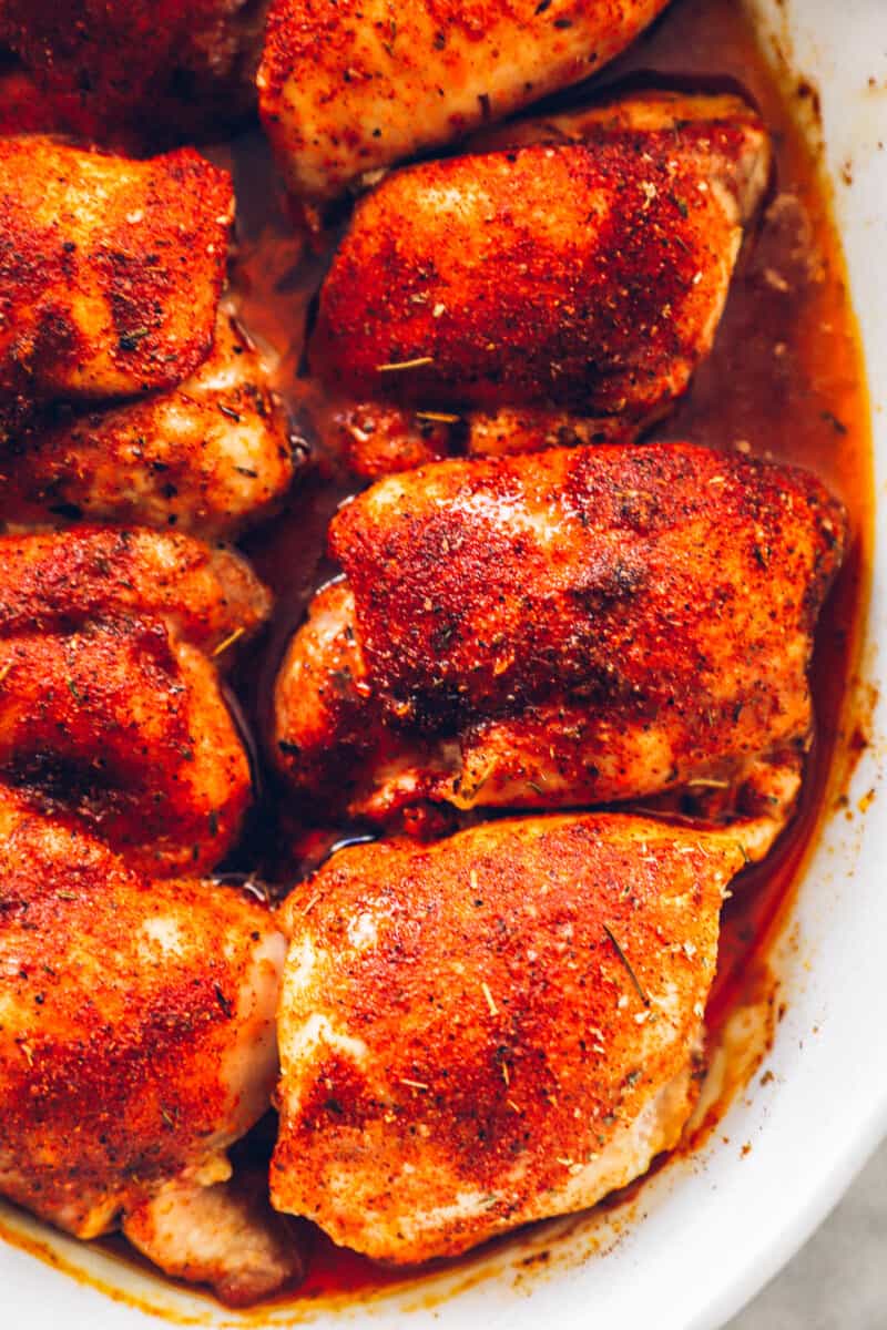 baked chicken thighs in a white baking dish