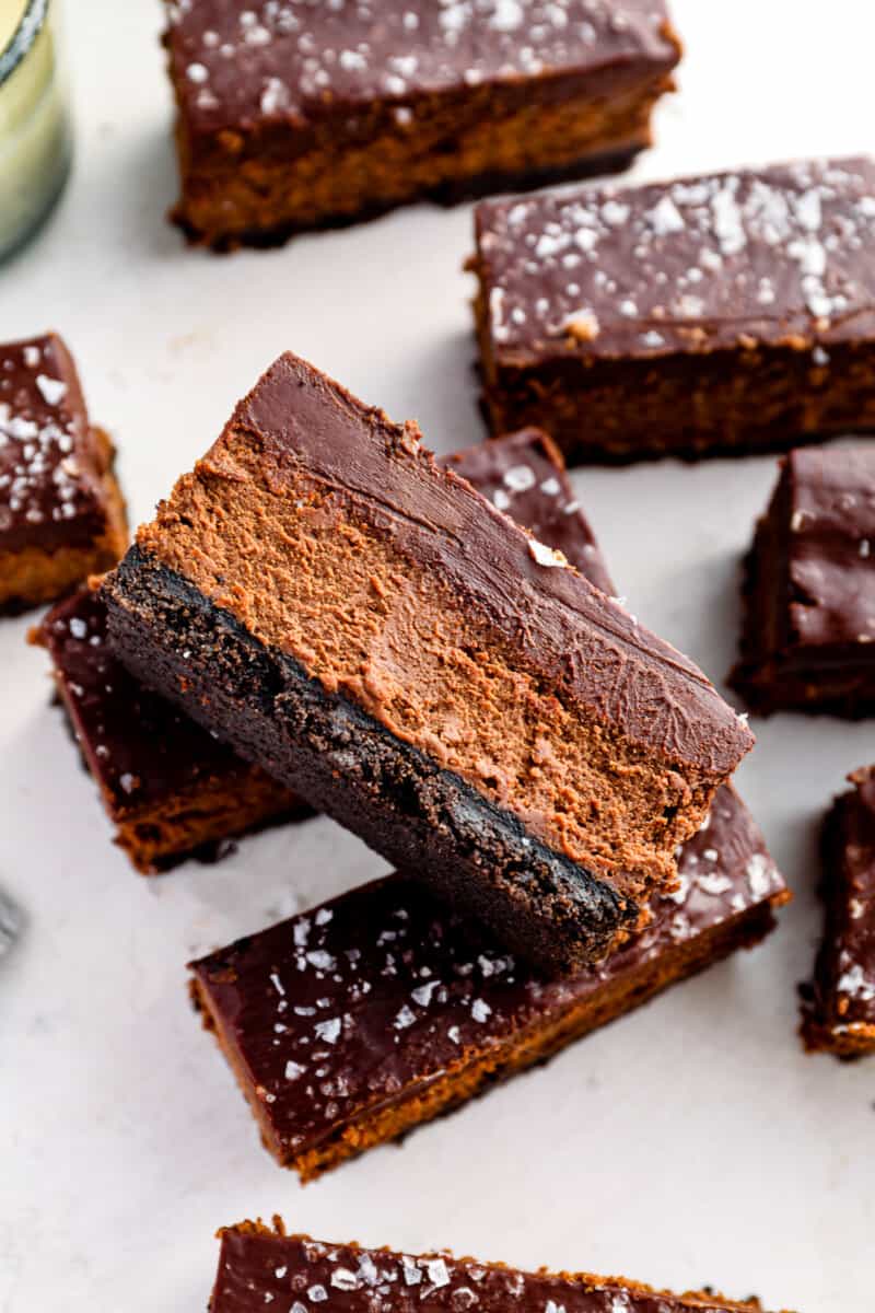 side view of a chocolate cheesecake bar showing the 3 layers