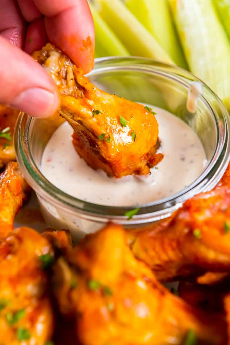 dipping crockpot chicken wing in ranch