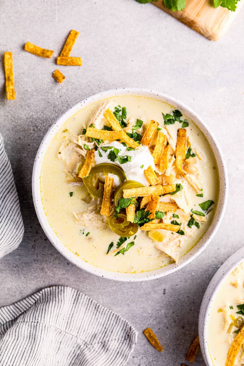 crockpot white chicken chili in white bowls