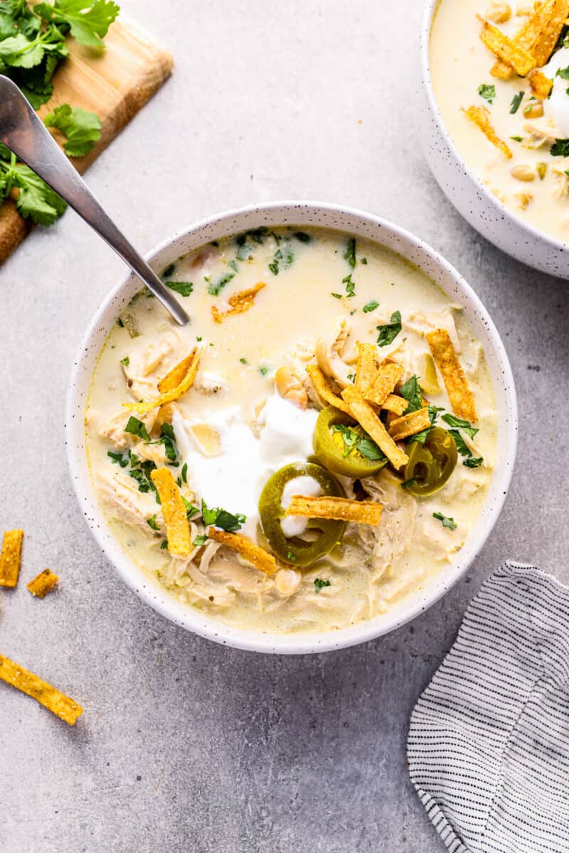 bowl of crockpot white chicken chili with spoon