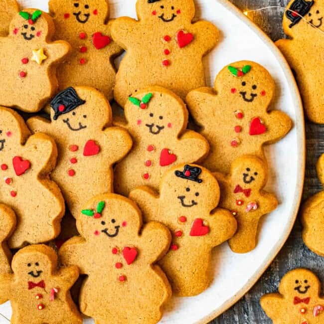 decorated gingerbread cookies on a white serving plate