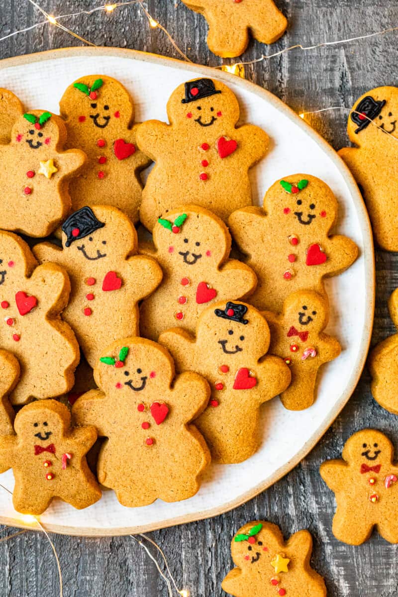 decorated gingerbread cookies on a white serving plate