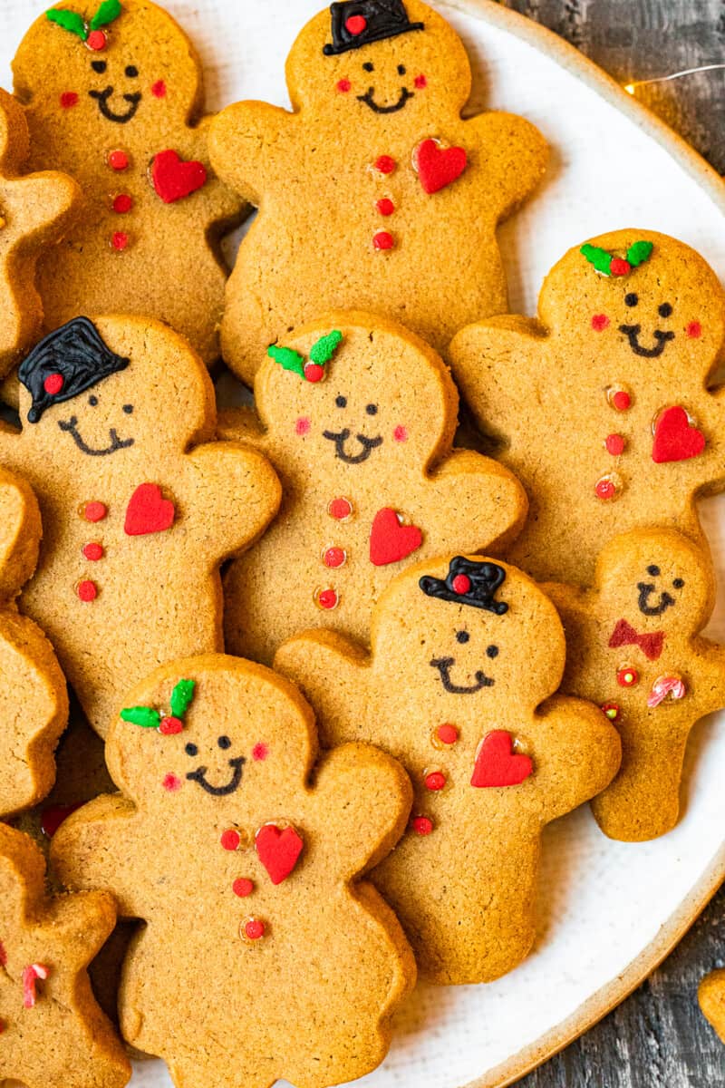 decorated gingerbread cookies on a white serving plate
