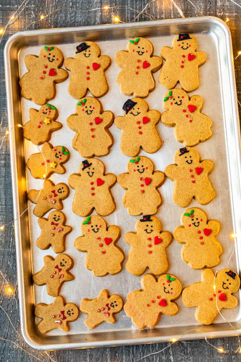 decorated gingerbread cookies on a baking sheet