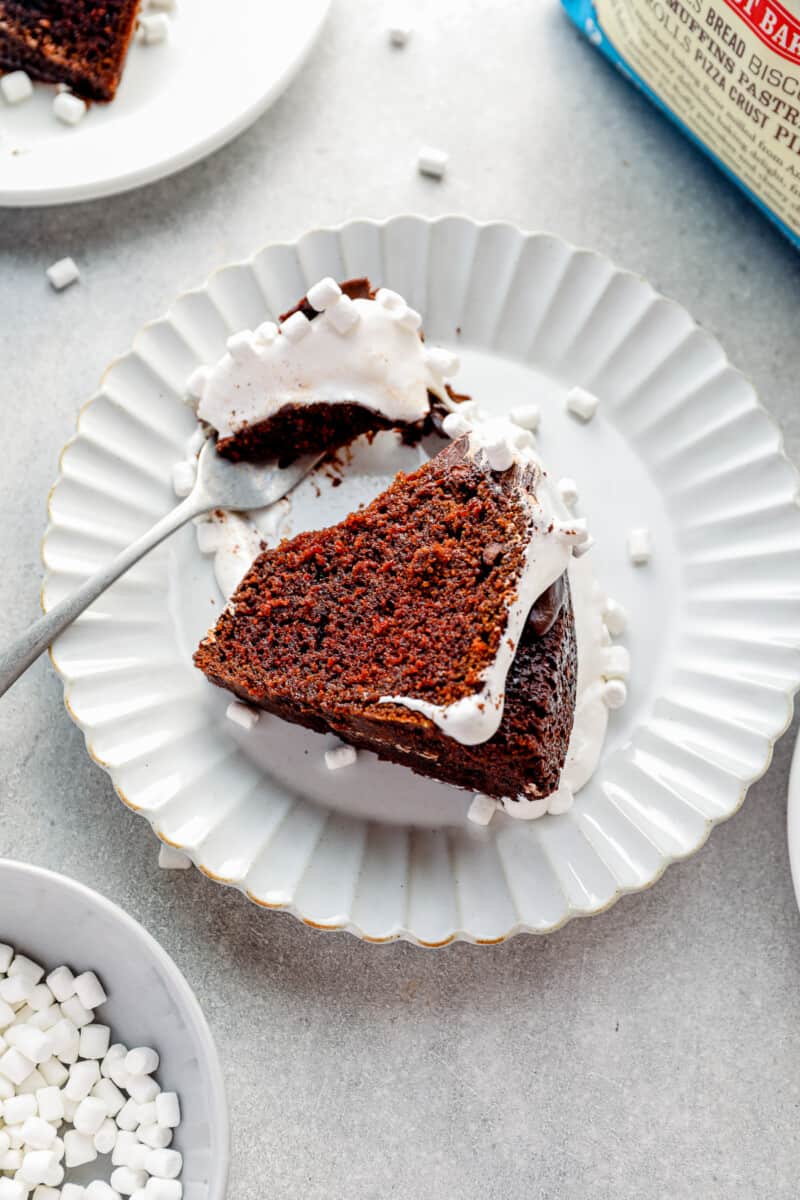 slice of hot chocolate bundt cake on a white plate with a fork