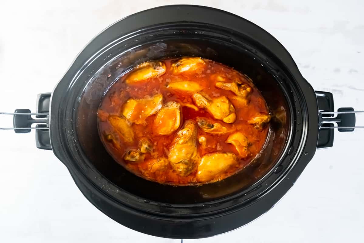 Crockpot chicken wings cooking.