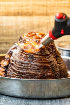 using a kitchen torch to caramelize honey baked ham