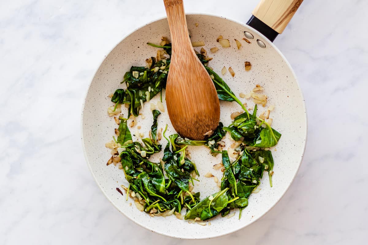 spinach and garlic in a pan.