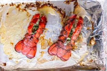 2 lobster tails on an aluminum foil lined baking sheet