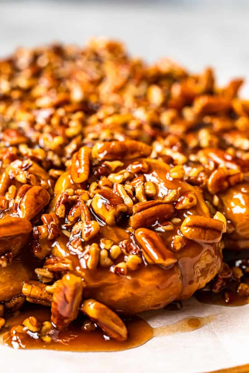 caramel pecan sticky buns on a white serving tray