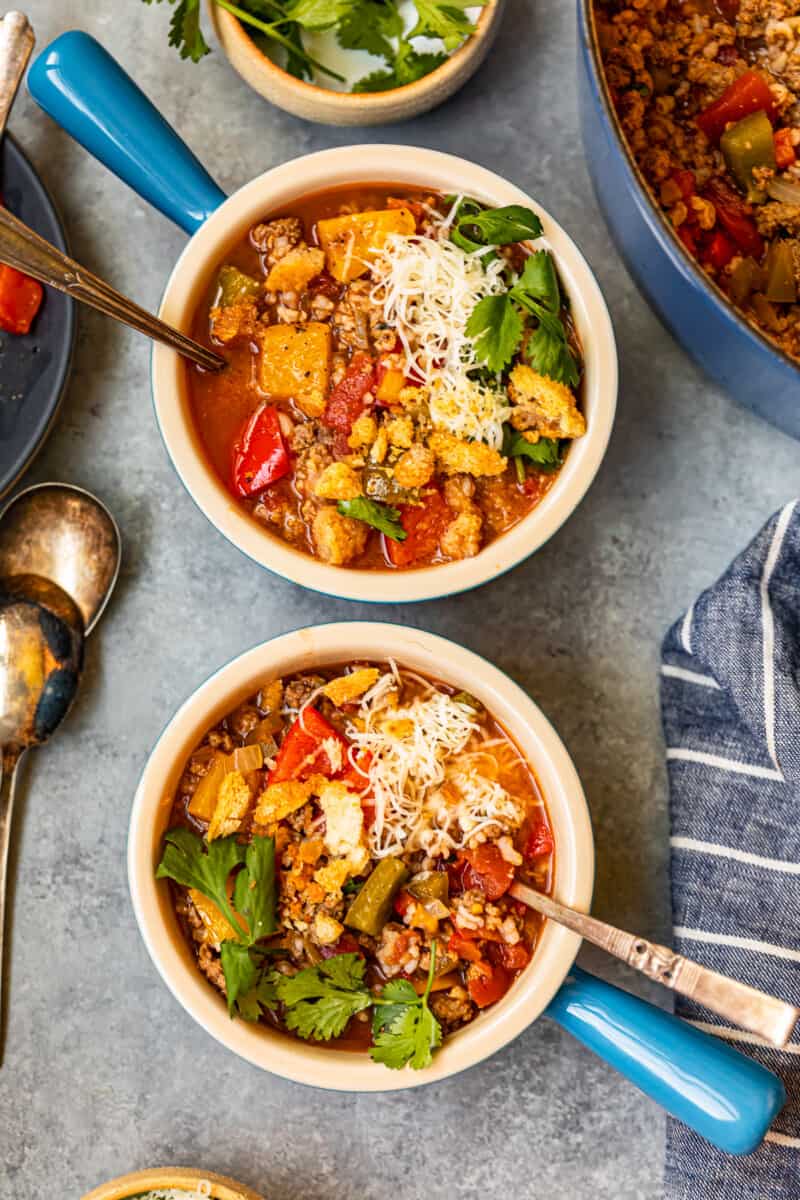 stuffed pepper soup in 2 bowls with spoons