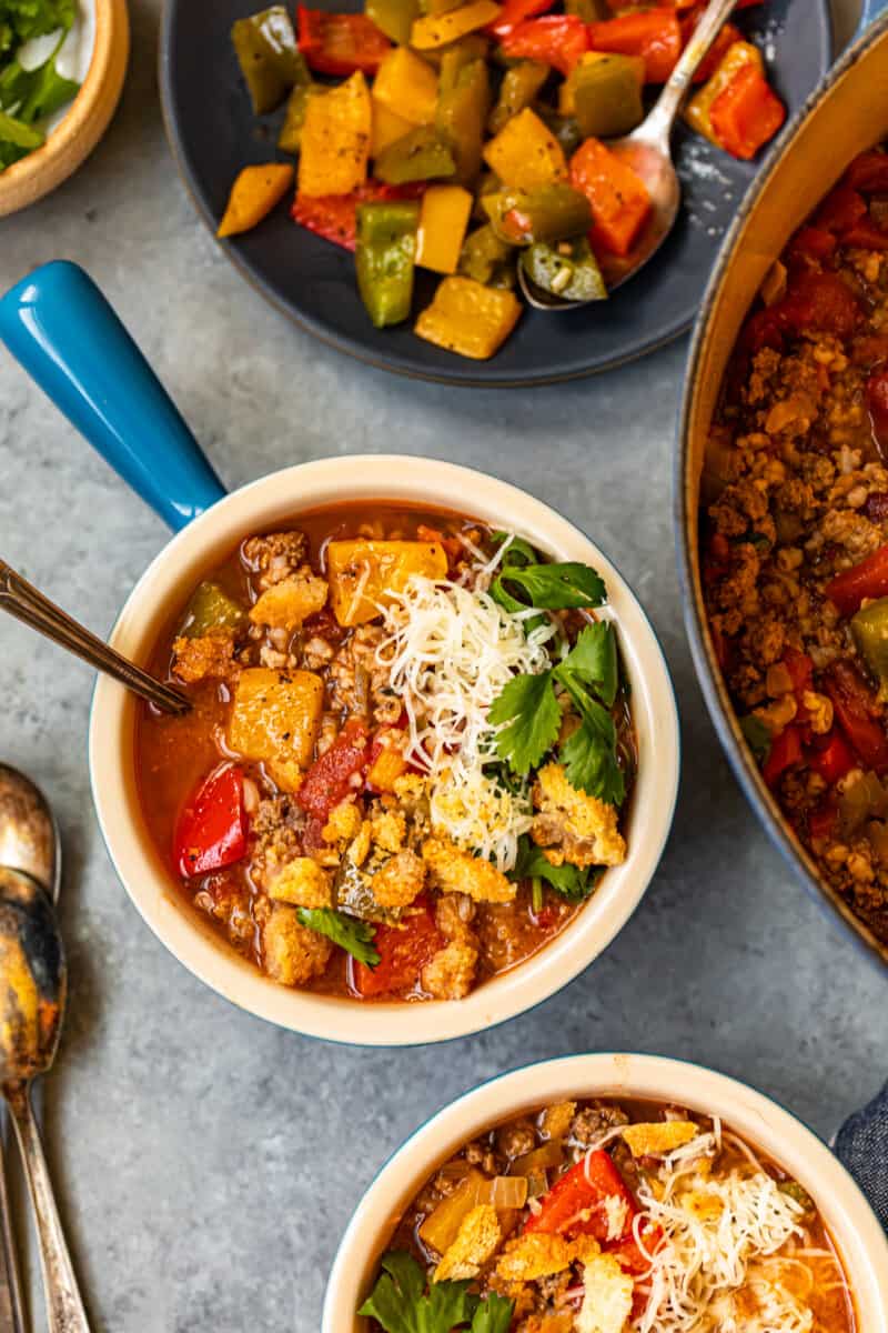 stuffed pepper soup in bowls with spoons