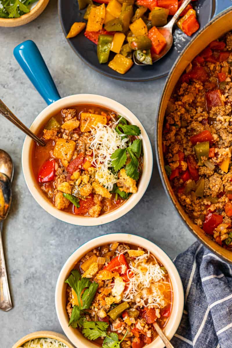 stuffed pepper soup in 2 bowls with spoons