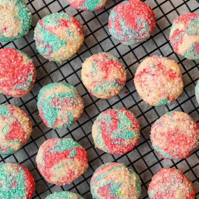 overhead image of tie dye cookies on a round cooling rack