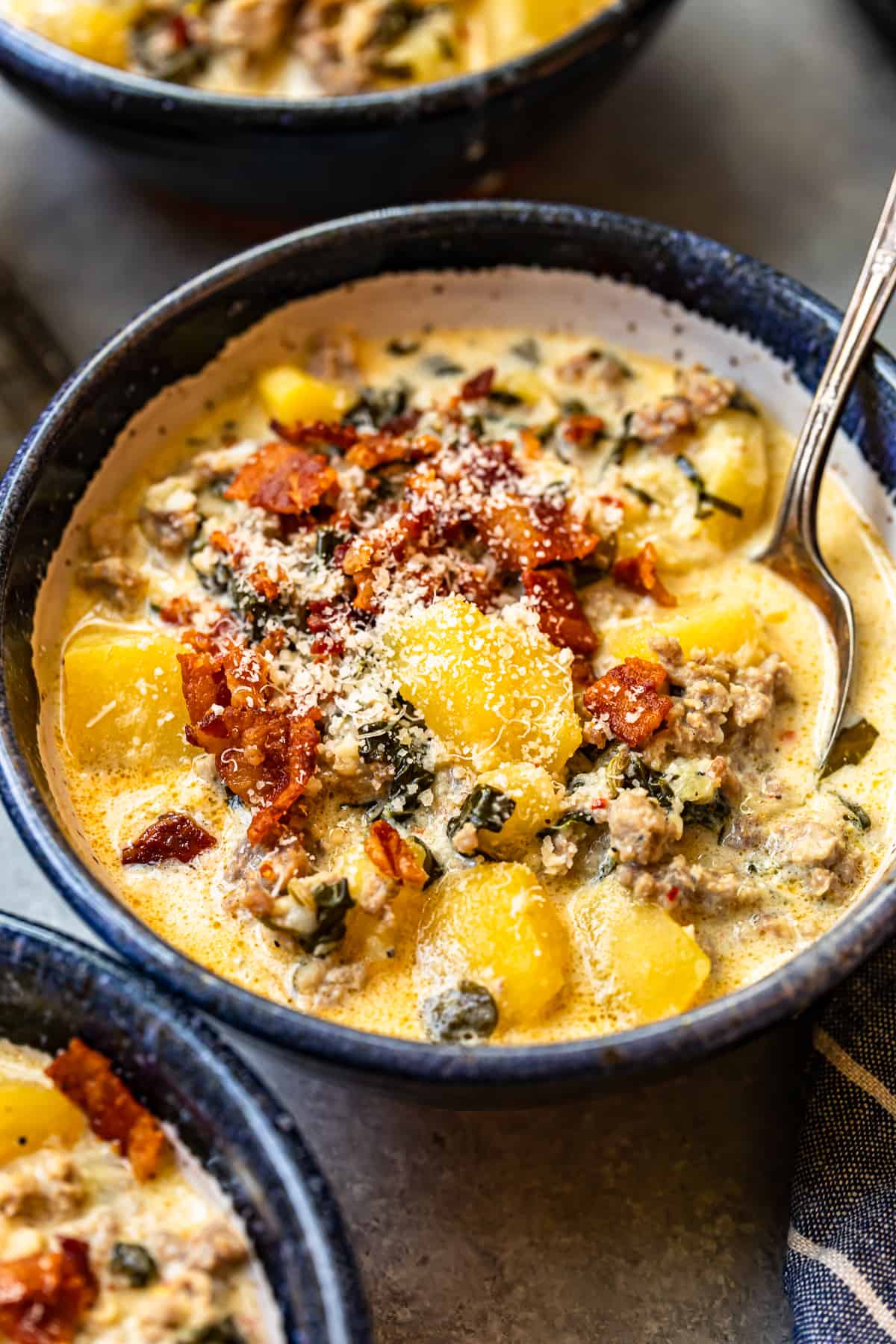 zuppa toscana soup in a bowl with a spoon