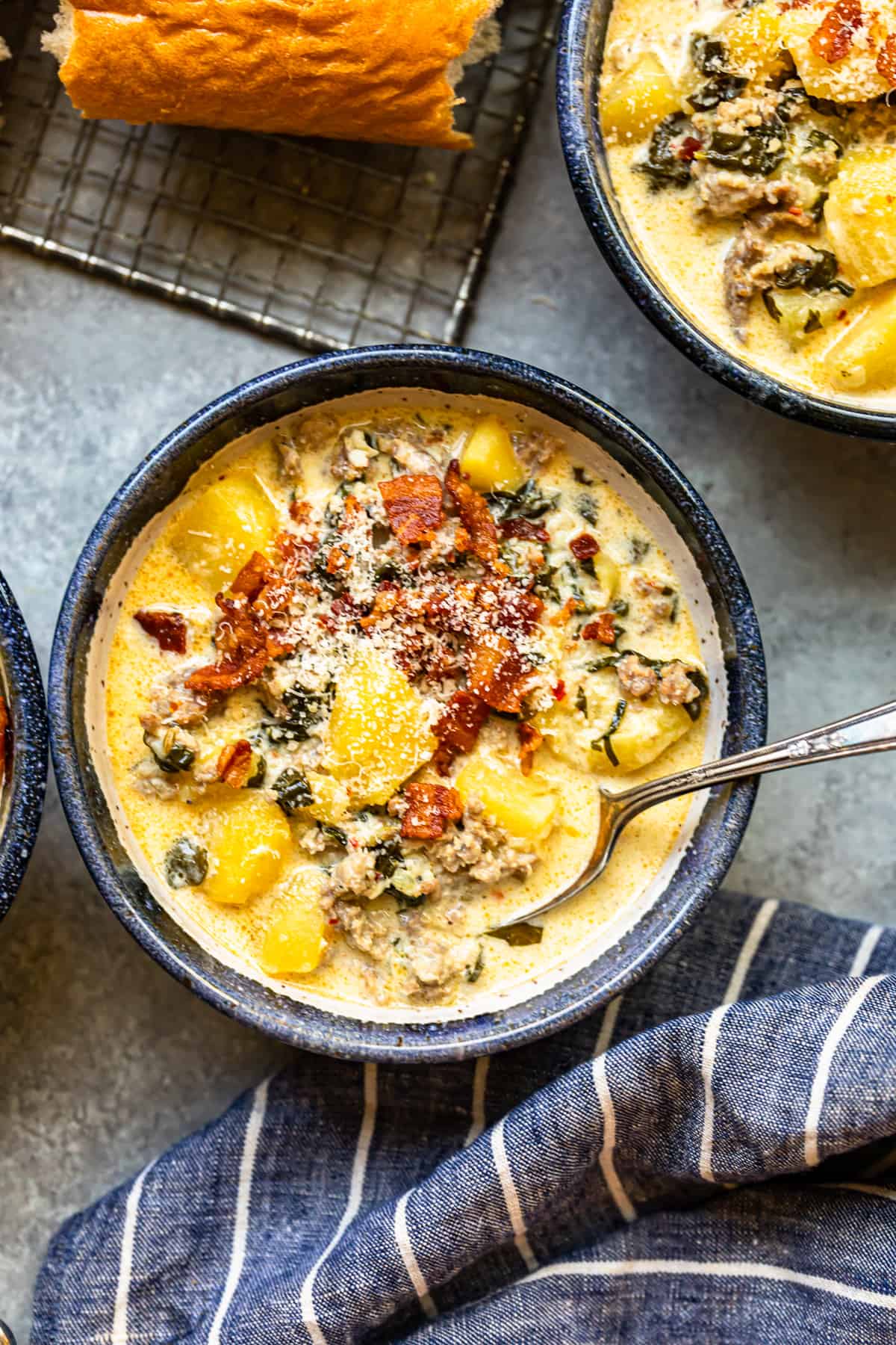 zuppa toscana soup in a bowl with a spoon