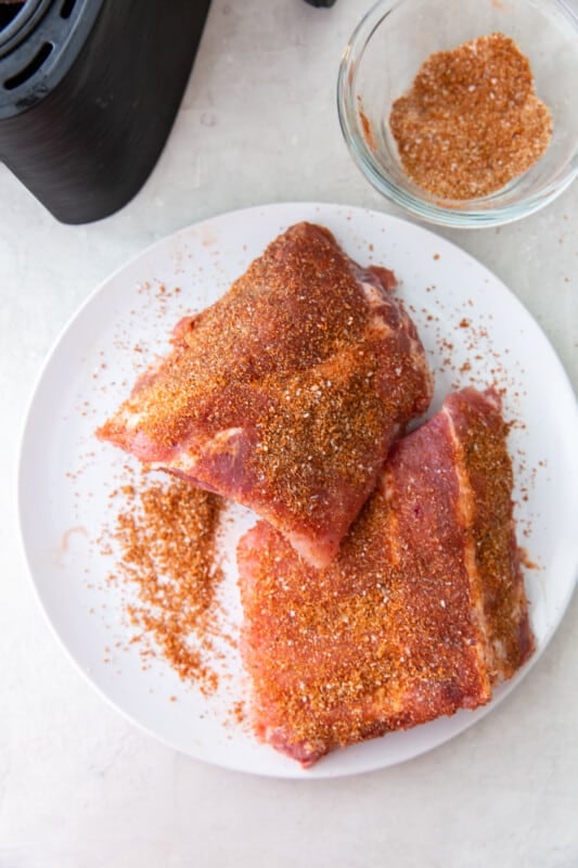 ribs with spice rub on a white plate