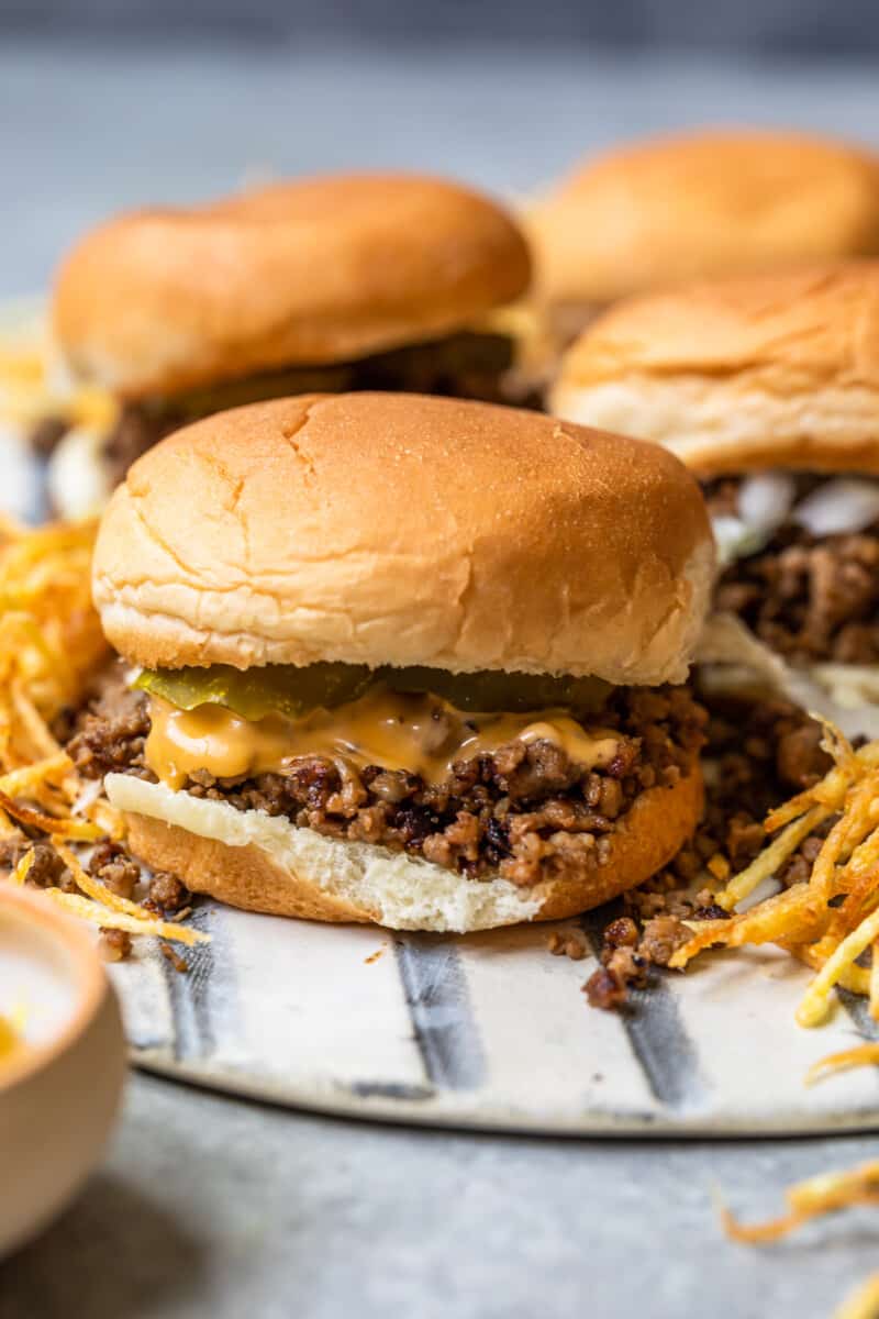 maid rite sandwiches topped with cheese and pickles