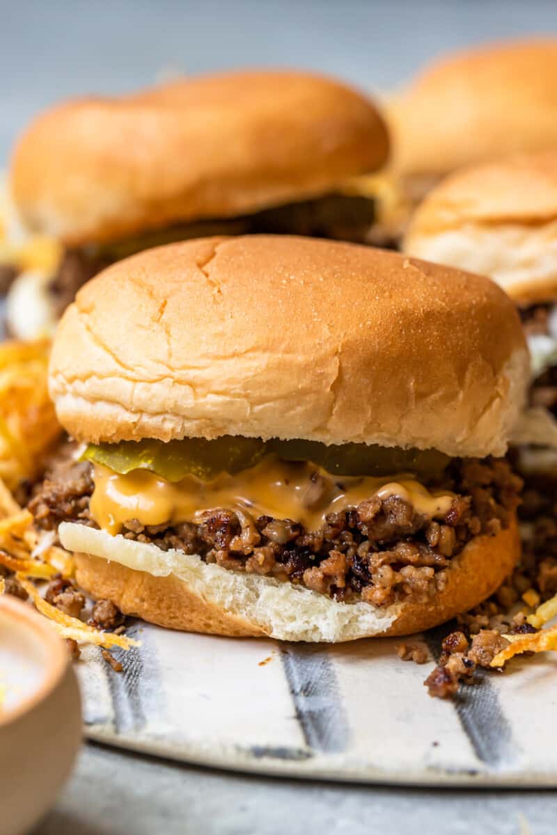 maid rite sandwiches topped with cheese and pickles