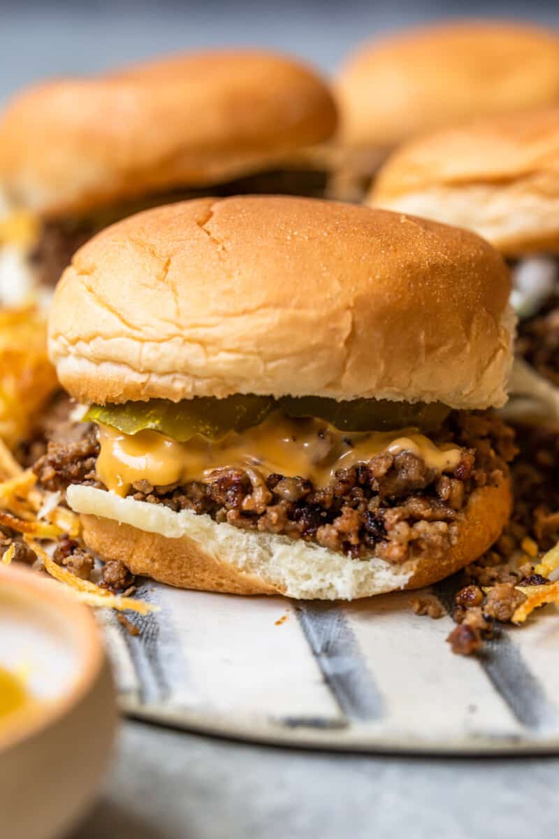 maid rite sandwiches topped with cheese and pickles