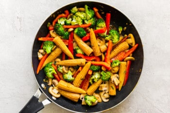 stir fry veggies in wok after cooking
